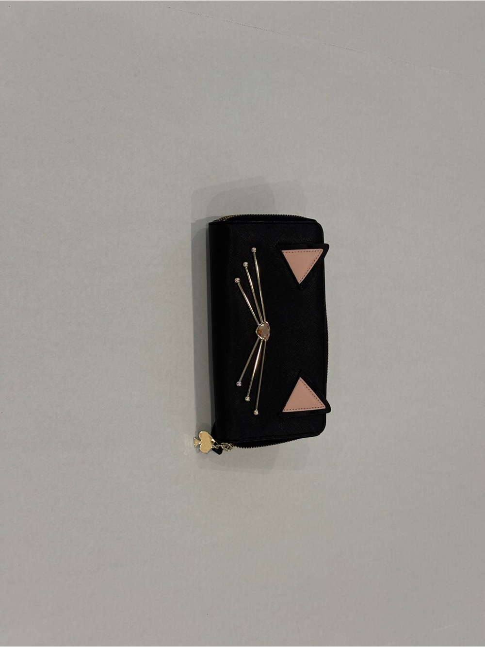 kate spade Black Wallet with Pink Triangle Accents and Gold Cat Whisker Detail